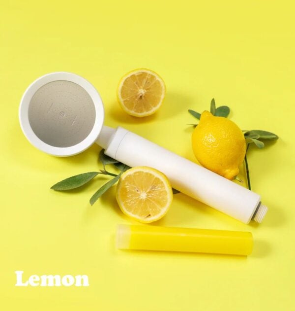 Fresh lemon water filter cartridge with lemon slices and green leaves, highlighting high-quality water filtration and citrus flavor enhancement. Perfect for healthy hydration and improving water taste.