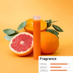 Refreshing citrus and grapefruit vape juice in an orange bottle, with whole and halved oranges and grapefruit, fresh green leaves, on vibrant yellow background, highlighting fruity flavor profile, perfect for summer vaping enthusiasts.