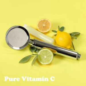 Fresh lemon and lime slices with a shower head on a vibrant yellow background, emphasizing vitamin C and skincare benefits.