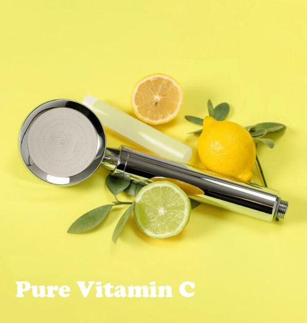 Fresh lemon and lime slices with a shower head on a vibrant yellow background, emphasizing vitamin C and skincare benefits.
