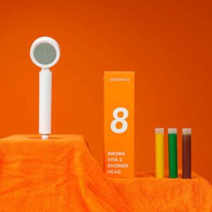 Filterplace.eu high-quality shower head with vibrant testing liquids for water filter and purification demonstration.