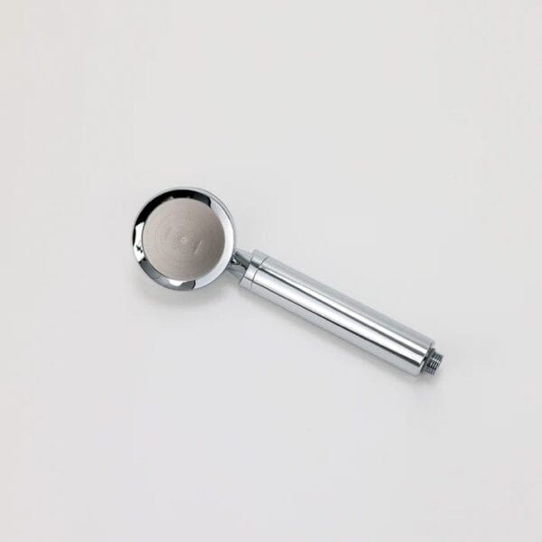 Shower head with a sleek, modern design, chrome finish, suitable for bathroom filtration systems and water quality improvement.