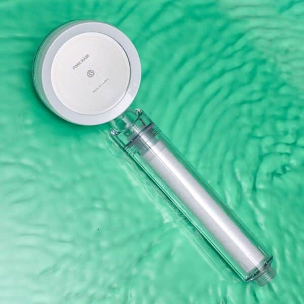 AquaPure water filter replacement with a sleek design on a green rippling water background.