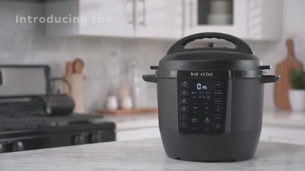 Digital rice cooker with touch control panel on a modern kitchen countertop, ready for cooking meals, offering convenience and advanced features for easy meal preparation.