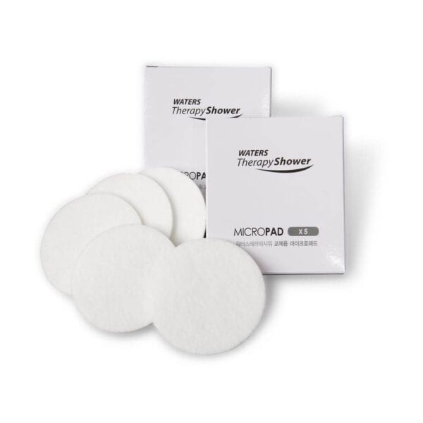Soft white microfilter pads for shower water filtration, eco-friendly and effective.